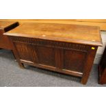 AN EARLY C19TH OAK COFFER CHEST the facade with three fielded panels, having sgraffito and marquetry