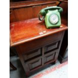 A MAHOGANY CUPBOARD & A VINTAGE TELEPHONE