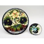A MOORCROFT POTTERY DISPLAY DISH in the 'Hellebore' pattern model no. 78310 designed by Nicola