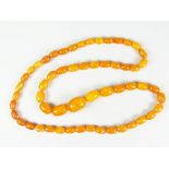 GRADUATED STRING OF AMBER BEADS, 72 cms long approx. 41 grams approx.