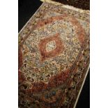 A GOOD PERSIAN CARPET with intricate floral medallion design in many colours, 189 x 126cms