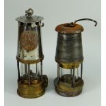 TWO ANTIQUE MINERS LAMPS one being a model by The Wolf Safety Lamp Company and inscribed