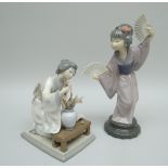 A LLADRO PORCELAIN SCULPTURE OF A DANCING GEISHA with decorative fans in each hand and long