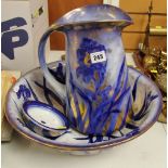 A STAFFORDSHIRE LUSTRE DECORATED BLUE AND WHITE FLORAL TOILET JUG AND BASIN SET