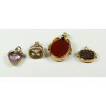 SMALL GROUP OF FOBS AND PENDANTS to include 9 carat gold revolving bloodstone and carnelian fob,