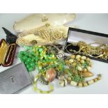 COSTUME JEWELLERY contained within a shoebox and includes yellow metal chains, bracelets, jade ring,