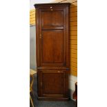 A C19TH WELSH OAK TWO SECTION CORNER BLIND-CUPBOARD having panelled exterior and shaped interior