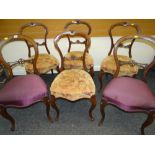 SET OF FOUR VICTORIAN DELICATE DINING CHAIRS OF CARVED BALLOON FORM with stuff-over cushion seats;