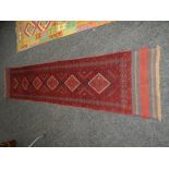MESHWANI RUNNER in red and blue ground geometric pattern, 277 x 62cms