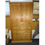 TURN-OF-THE-CENTURY PINE PANELLED KITCHEN BLIND CUPBOARD comprising base of five graduated