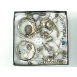 PARCEL OF WHITE METAL / SILVER JEWELLERY to include bright-cut bangle, charms, earrings and rings