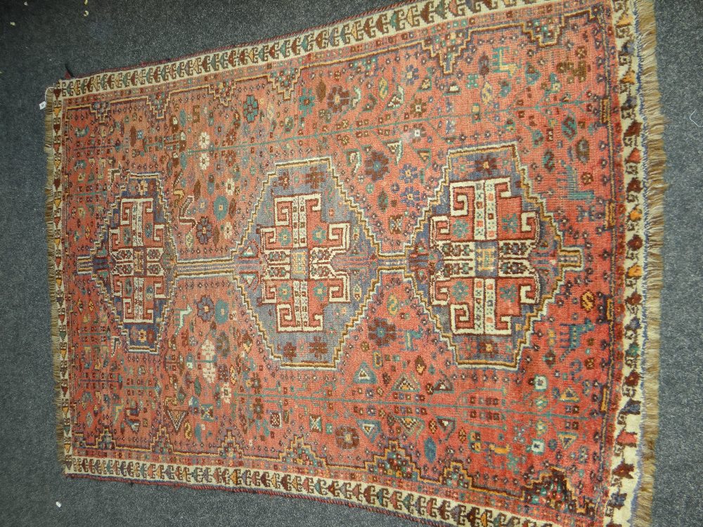 HAND WOVEN WOOL IRANIAN RAMEZANI SHIRAZ WOOLEN RUG in pale red and blue ground, decorated with