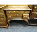 ANTIQUE REGENCY STYLE MAHOGANY LOWBOY having a bank of four drawers and on ball and claw cabriole