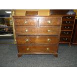 19TH CENTURY OAK CHEST OF THREE LONG AND TWO SHORT DRAWERS on carved bracket feet and with brass