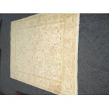 PALE CREAM & BROWN WOOLEN RUG with flower design in a centre square, 198 x 245cms
