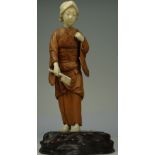 JAPANESE MEIJI PERIOD IVORY AND BOXWOOD FIGURE wearing fruit engraved kimono, with axe in her