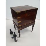 REGENCY ROSEWOOD BRASS BOUND WINE COOLER ON STAND with twin brass carry handles, the interior with