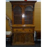 EARLY VICTORIAN MAHOGANY SECRETAIRE BOOKCASE having a two door cupboard base with arched panels