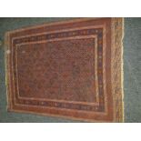 MAINLY BLUE & RED GROUND PERSIAN WOOLEN RUG with geometric design, diamond shaped centre panel,