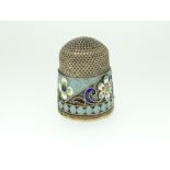 EASTERN EUROPEAN SILVER GILT & CLOISSONE THIMBLE having a multi-coloured band of flowers and