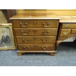 GOOD CHEST OF DRAWERS composed of four graduated long drawers on bracket feet, brass swan-neck