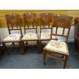 SET OF FOUR MATCHING OAK HIGH BACKED ART NOUVEAU STYLE DECORATED DINING CHAIRS with drop in seats