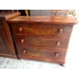 ANTIQUE FLAME-MAHOGANY COMPACT THREE-DRAWER CHEST OF DRAWERS on bun feet