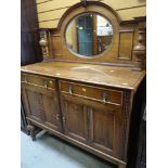 VINTAGE OAK MIRROR BACKED SIDEBOARD on raised feet with two drawers above two cupboards, 122cms