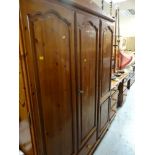 PINE TRIPLE WARDROBE WITH DRAWER BASE together with a pine dressing table and stool