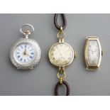 TWO 9CT GOLD CASE LADY'S WRIST WATCHES, one with leather strap and a silver case lady's fob watch