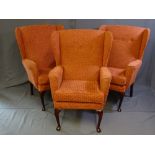 A PARCEL OF THREE MATCHING UPHOLSTERED WING BACK CHAIRS