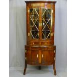 A MAHOGANY STANDING CORNER CUPBOARD, early to mid 20th century two piece bow front, the upper