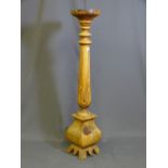 A LIGHTWOOD CARVED COLUMN TORCHERE