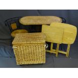 A WICKER WROUGHT IRON TABLE AND TWO CHAIRS, a woven storage basket and two light wood folding