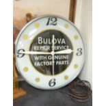 A BULOVA REPAIR SERVICE ADVERTISING CLOCK, stamped November 1956, to the edge