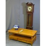 A REPRODUCTION GRANDMOTHER CLOCK with brass dial, two tier light oak coffee table with end of