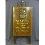 A VINTAGE ADVERTISING EASEL with coat of arms and 'Staples and Co Ltd By Appointment to H.M. The