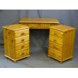 A PAIR OF PINE FOUR DRAWER BEDSIDE CHESTS, a similar pine dressing table with two drawers and triple