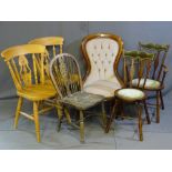 A REPRODUCTION BUTTON BACK UPHOLSTERED CHAIR, circular seated velour and brass stud upholstered