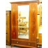 AN EDWARDIAN INLAID MAHOGANY MIRRORED WARDROBE with classical urn and floral swag detail, 208cms