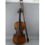 A VINTAGE WELL USED VIOLIN AND TWO BOWS interior spurious 'Stradivarius' label dated 1720, 59cms