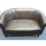 A TWO SEATER BROWN LEATHER EFFECT CURVED SETEE