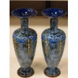 A PAIR OF ROYAL DOULTON BLUE GLAZED NARROW NECK VASES, 23cms tall