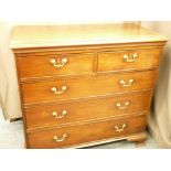 AN EARLY 19TH CENTURY MAHOGANY CHEST of two short over three long drawers, oak lined with cock