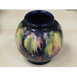 MOORCROFT 'WISTERIA' BLUE GROUND BALUSTER VASE, 16cms height