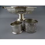 A SILVER SWING HANDLED BREAD BASKET and two napkin rings, Birmingham 1925, maker William Suckling