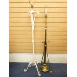 A VICTORIAN BRASS EXTENDING STANDARD LAMP and a painted wrought iron example with dragon head