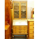 A VINTAGE OAK BUREAU BOOKCASE with leaded glass top section, 200cms height, 75cms width, 43cms