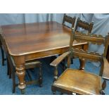 A VICTORIAN MAHOGANY WIND-OUT DINING TABLE and a set of five (4+1) oak dining chairs with rexine