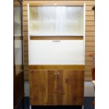 A CREAM AND WOOD EFFECT KITCHEN CABINET BY FORTRESS LTD, top shelves with sliding glass doors, a